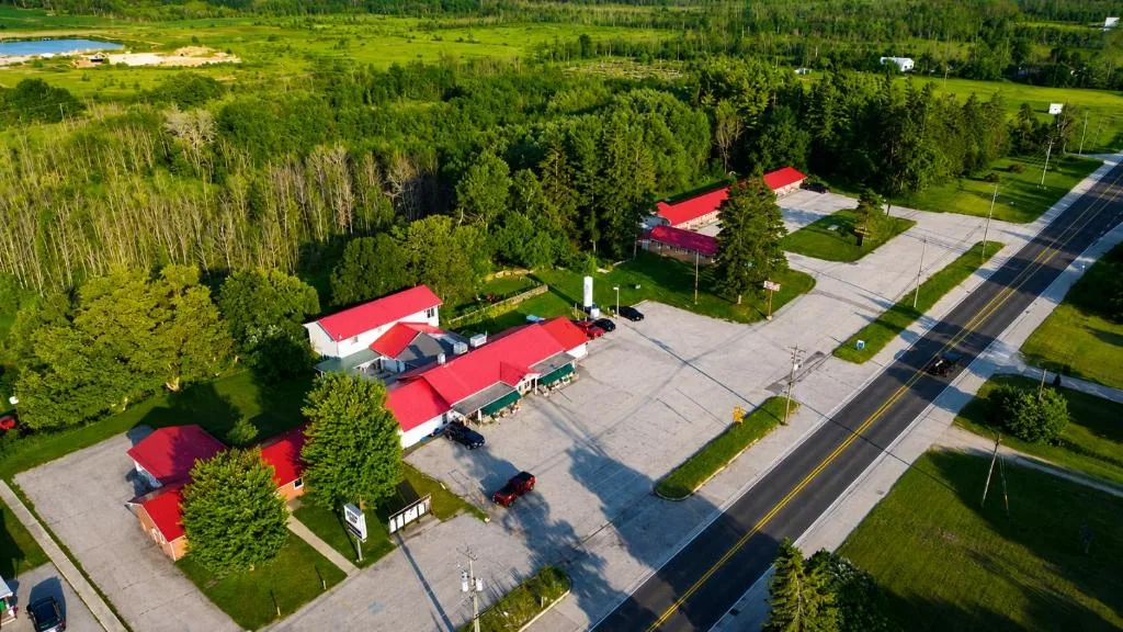 Wide aerial view showing the Top Notch motel buildings and grounds